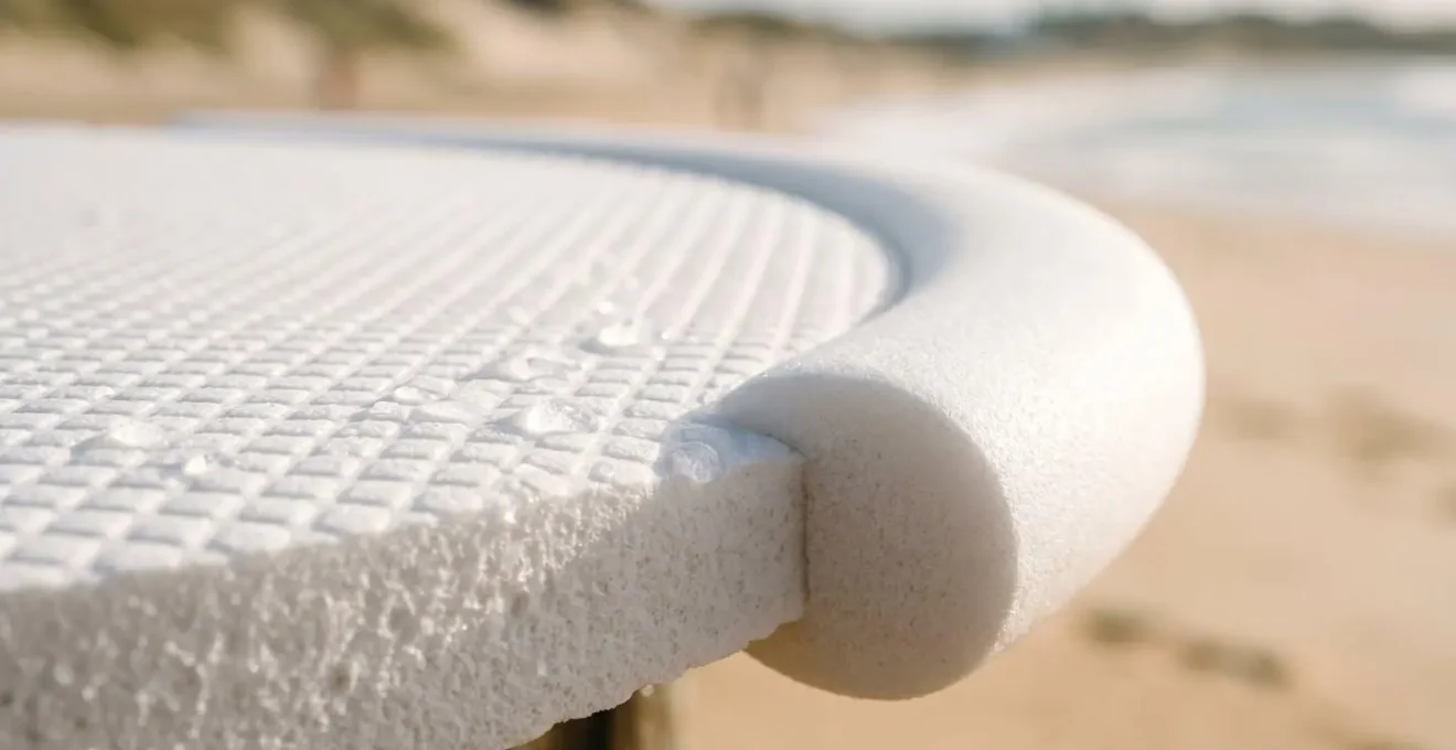 Close-up of foam surfboard showing buoyant texture and safer construction for beginner surfers